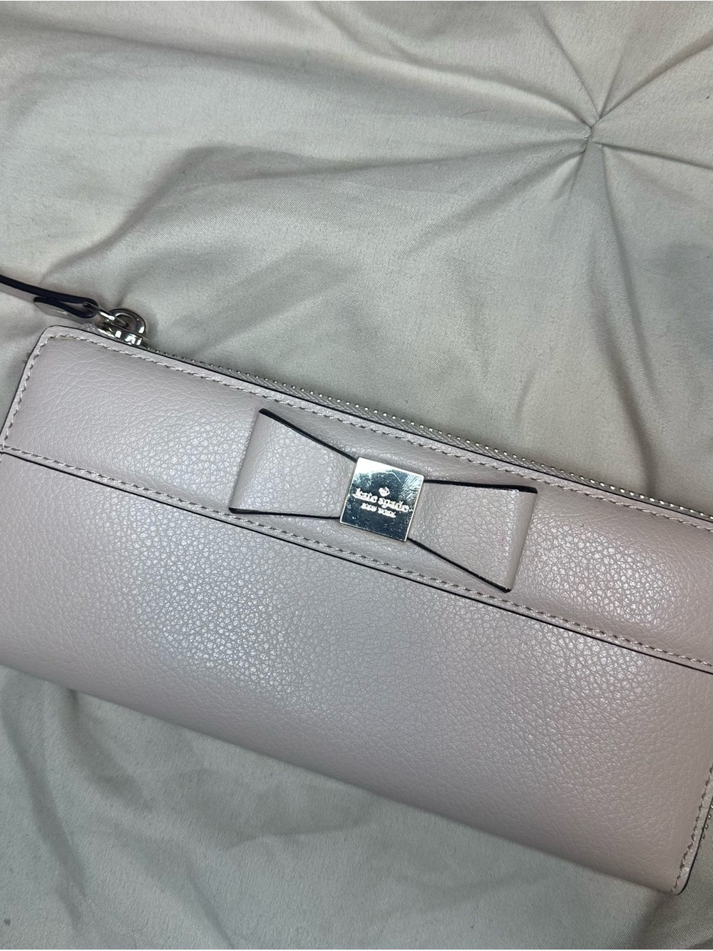 kate spade pale pink leather bow zip-around wallet